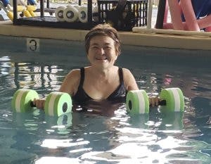 Woman laughing in aquatic therapy pool