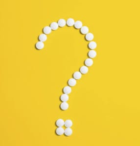 Question mark made of pills