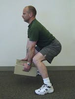 Photo of Brent lifting a box